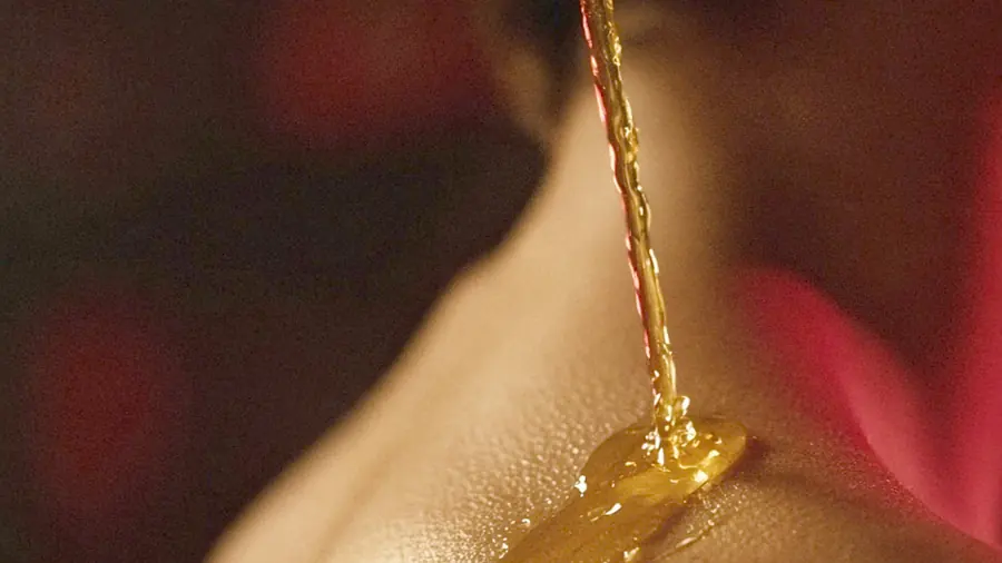 Body to body massage near me - a candlelit room and a body oiled for a session