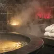 Erotic spa near me - a candlelit room and a body oiled for a session