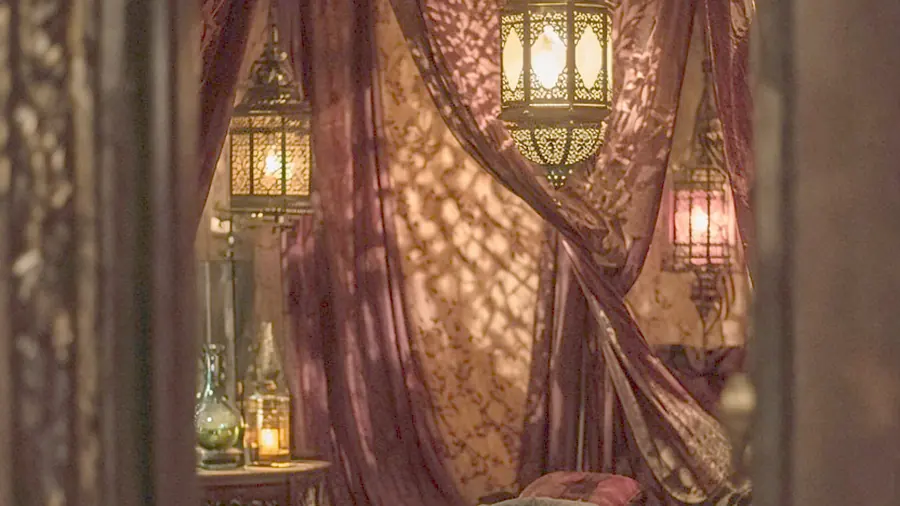 Exotic massage near me - oiled bare back on a massage table in candlelight