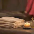 Happy ending massage near me - a candlelit room and a body oiled for a session