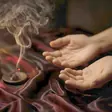 Lingam massage near me - a candlelit room and a body oiled for a session