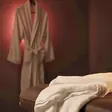 Nude massage near me - a candlelit room and a body oiled for a session