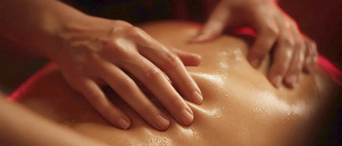Sensual massage near me - a candlelit room and a body oiled for a session