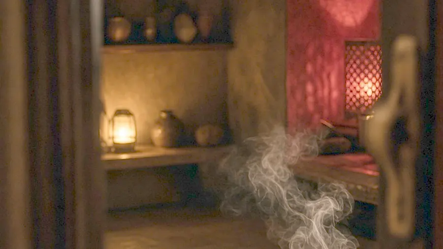 Thai massage near me - oiled bare back on a massage table in candlelight
